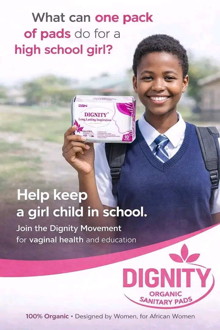 Schoolgirl holding a pack of Dignity Organic Sanitary Pads